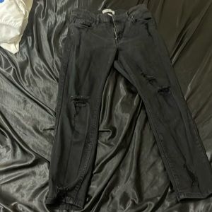 Black ripped skinny jeans.